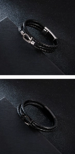 Detail of black braided leather bracelet with magnetic stainless steel horseshoe clasp