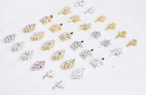 Detailed flat lay of metal nail art charms featuring turtles, stars, and pearls