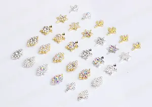 Macro shot of assorted nail charms including turtles and stars with pearls and rhinestones