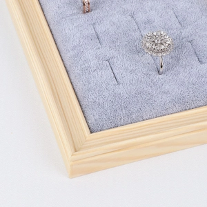 Wooden earring and ring display tray with grey velvet slots for jewelry storage