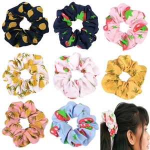 Detailed grid of 9 pineapple and strawberry pattern fabric scrunchies in various colors