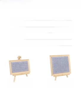 Macro detail of wooden frame jewelry display with ice grey velvet slots for rings and studs