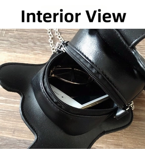 Internal display of guitar-shaped crossbody bag showing phone and sunglasses storage