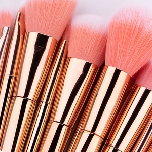 12pcs rose gold makeup brush set with coral pink bristles for blush and eyeshadow