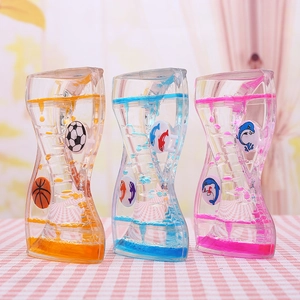 Close-up of liquid motion hourglass with colorful oil drops and sports patterns