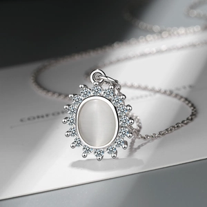 Elegant silver flower necklace with cat eye stone and cubic zirconia halo pendant