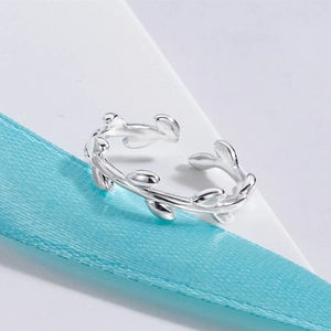 Adjustable silver olive leaf open ring in a minimalist nature-inspired forest style