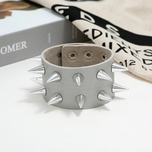 Detail of grey punk leather bracelet with double row silver conical metal studs