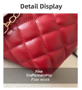 Close-up of red quilted leather with diamond stitching and luxury gold chain detail