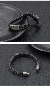 Close-up of industrial braided metal bracelet with magnetic clasp in retro silver finish