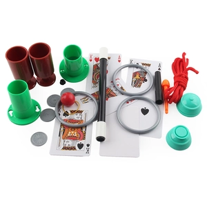 Kids magic trick kit with magic wand, cups, playing cards and accessories on white background