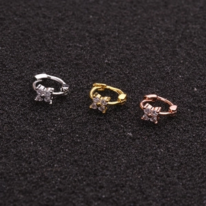 Three zircon clover cartilage earrings in silver, gold, and rose gold finishes