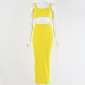 Detail of yellow ribbed knit crop top and high waist slim fit maxi skirt set on mannequin