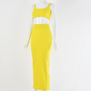Detail view of yellow two-piece knit set featuring a cropped cami top and maxi skirt
