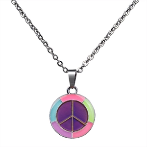 Detailed macro view of colorful enamel peace symbol pendant with silver cross chain