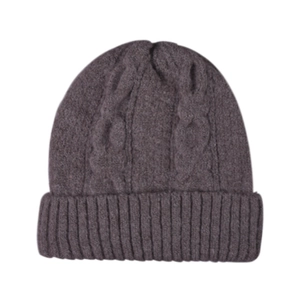 Detail of cable knit texture and wide cuff on dark brown winter beanie hat