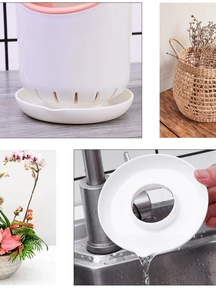 Detail view of white plastic utensil holder with drainage holes and removable base tray
