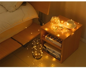 Warm white LED copper wire fairy lights wrapped in glass jar for cozy room decoration