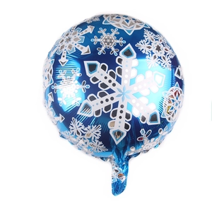 Close-up of blue foil balloon with white snowflake patterns for winter party decor