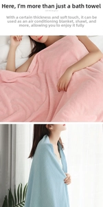 Detail of soft waffle weave towels in pink and blue colors used as cozy blankets