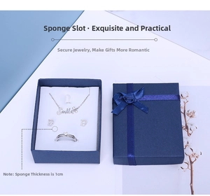 Detail of dark blue jewelry gift box with ribbon bow and 1cm thick sponge insert