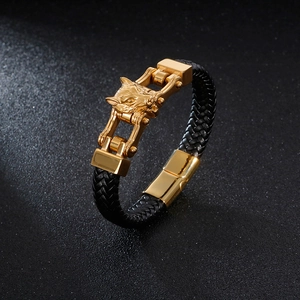 Men's braided leather bracelet with golden lion head charm and magnetic clasp closure