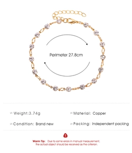 Detail of minimalist copper anklet with clear round rhinestones and lobster clasp
