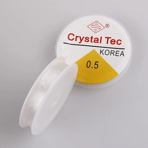 Macro view of 0.5mm clear elastic crystal cord rolls for DIY jewelry and bracelet making