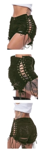Detail of dark denim shorts featuring side lace-up cutouts and distressed fringe hem