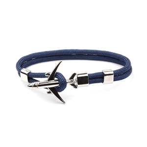 Men's blue braided polyester rope bracelet with silver airplane charm on white background