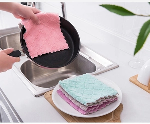 Macro view of thick microfiber dishcloths with wave edges and absorbent waffle texture