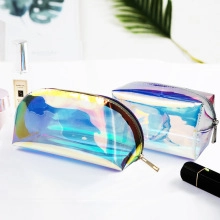 Detail view of holographic laser heart charms on semi-circular and square crossbody bags