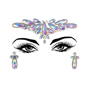 Macro shot of iridescent face jewels and holographic gem stickers for Halloween makeup look