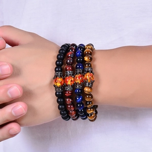 Set of four natural tiger eye and matte stone bracelets with antique silver crown beads