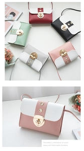 Detailed flat lay of color-blocked PU leather crossbody bags with gold metal clasps