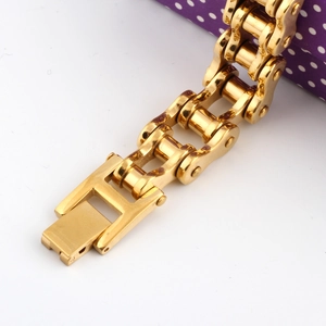 Detail of 12mm golden stainless steel bicycle chain bracelet with fold-over clasp
