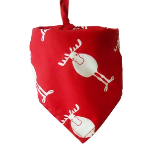Detail of red Christmas pet bandana featuring white cartoon elk pattern with tie knots