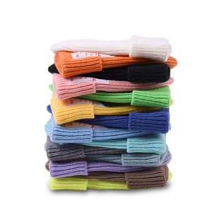 Colorful ribbed knit beanies for kids featuring stylish labels in multiple vibrant colors