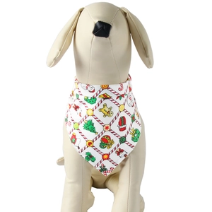 Close-up of cotton Christmas pet bandana with festive gingerbread and tree patterns
