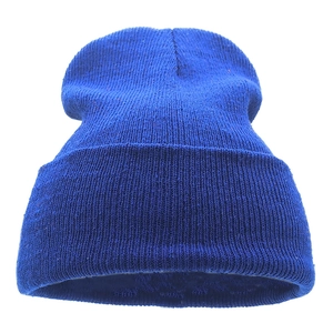 Close-up of vibrant blue ribbed knit beanie showing high-quality wool texture details