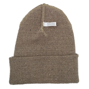 Detail showing brown 100% polyester knit texture and fabric care label on the winter hat