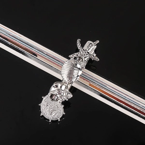 Close-up of silver sea star hair clip with shell and conch embossed metal texture