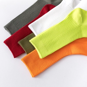 Colorful ribbed mid-calf cotton socks in gray, red, green, white, yellow, and orange