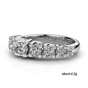 Exquisite silver ring with seven graduated round zircons in a claw-set wedding band