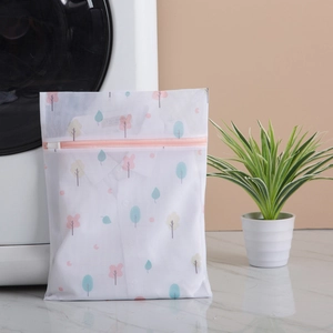 Thickened mesh laundry bag with colorful tree patterns and pink zipper for washing machines