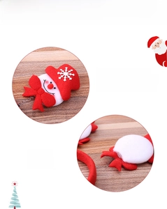 Detail of light-up Christmas snowman headband with LED switch on the nose feature