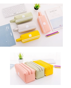 Primer plano del estuche escolar de doble capa con asa y cremallera en colores pastel