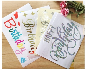 Detail of multi-color holographic Happy Birthday stickers for festive balloon decorations