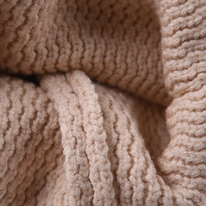 Beige chunky ribbed knit beanie hat featuring thick wool texture and warm cuff design