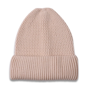 Detail shot of the vertical wave knit pattern on this light pink cuffed winter beanie
